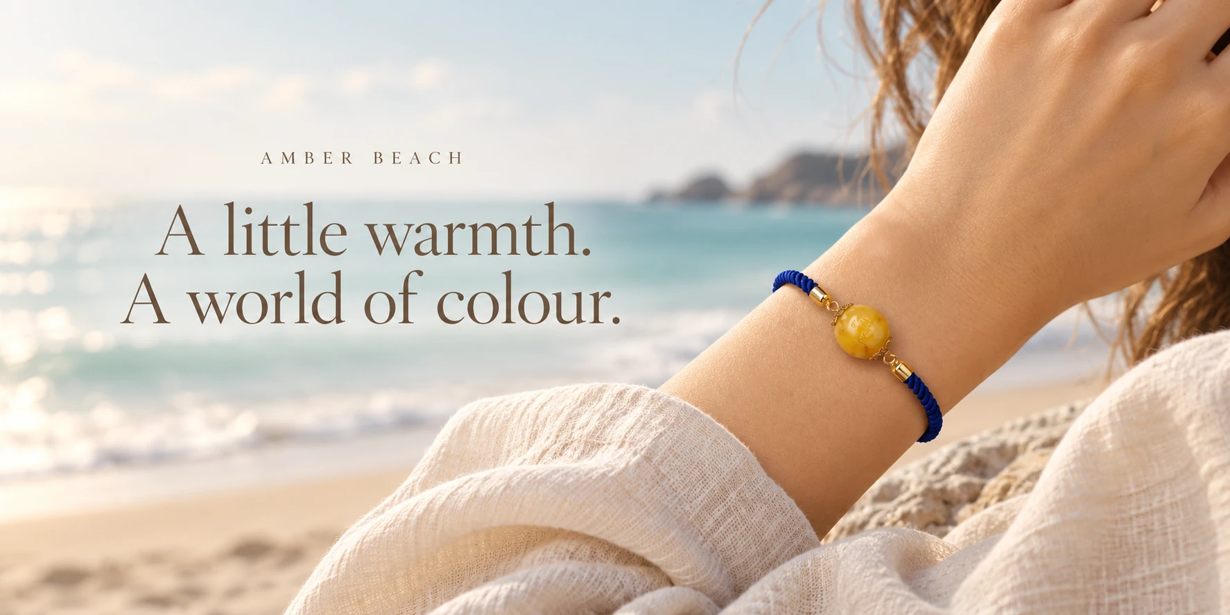 A little warmth. A world of colour. Blue honey amber bracelet at the coast.
